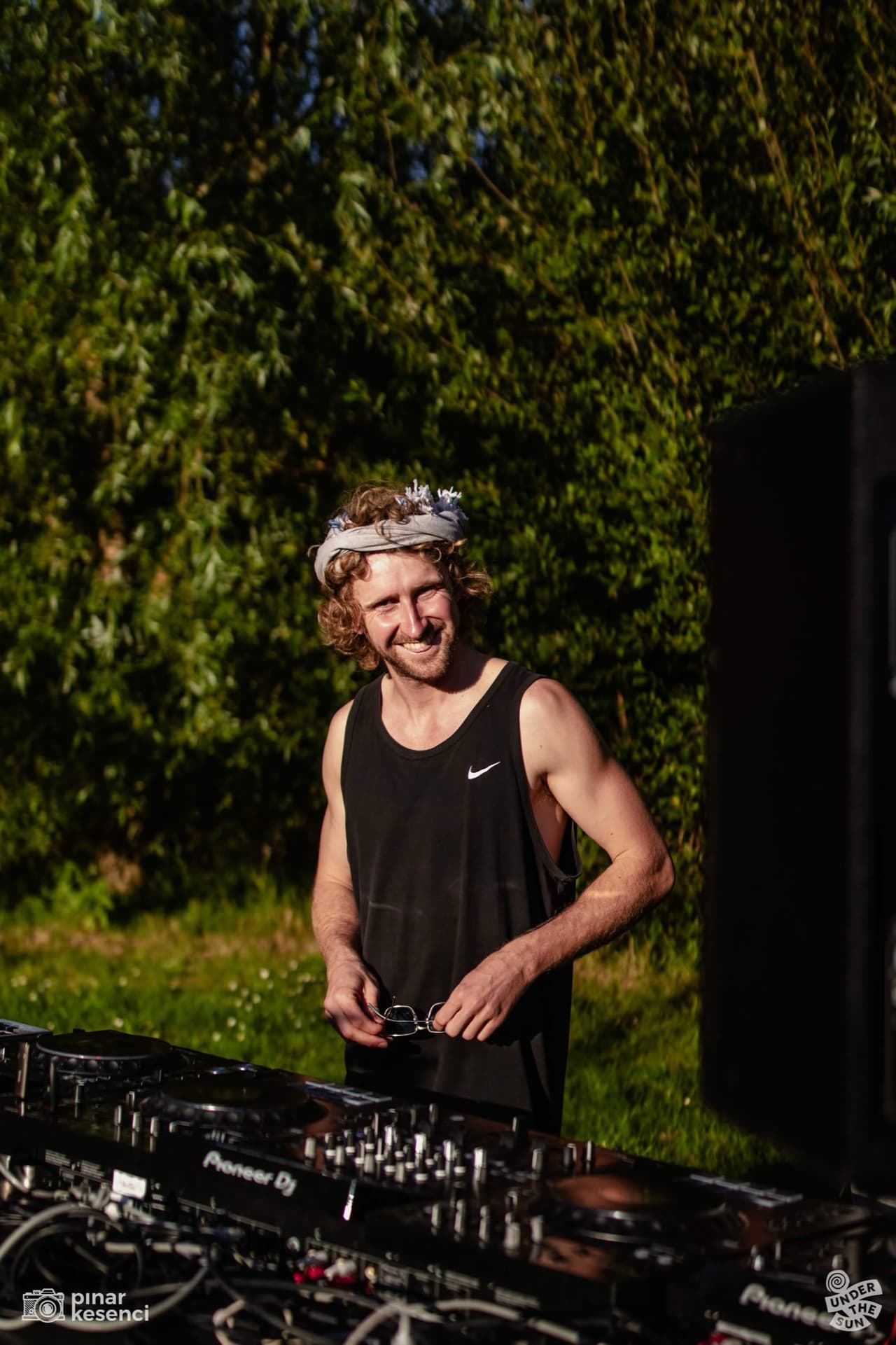 Henners DJing outdoors at Under the Sun